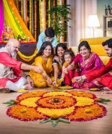 Indian,Family,United,In,Making,Diwali,Flower,Rangoli,,Ganesh,Festival